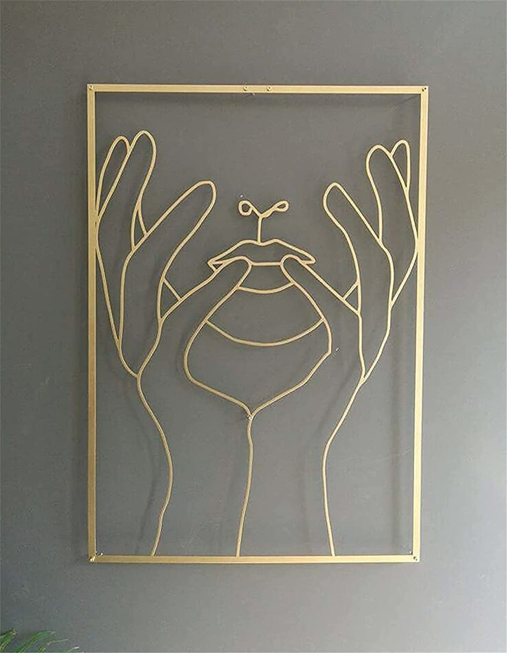 Gold framed wall art featuring feminine art design