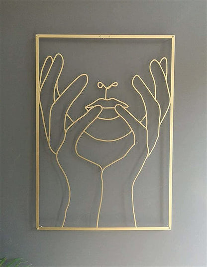 Gold framed wall art featuring feminine art design