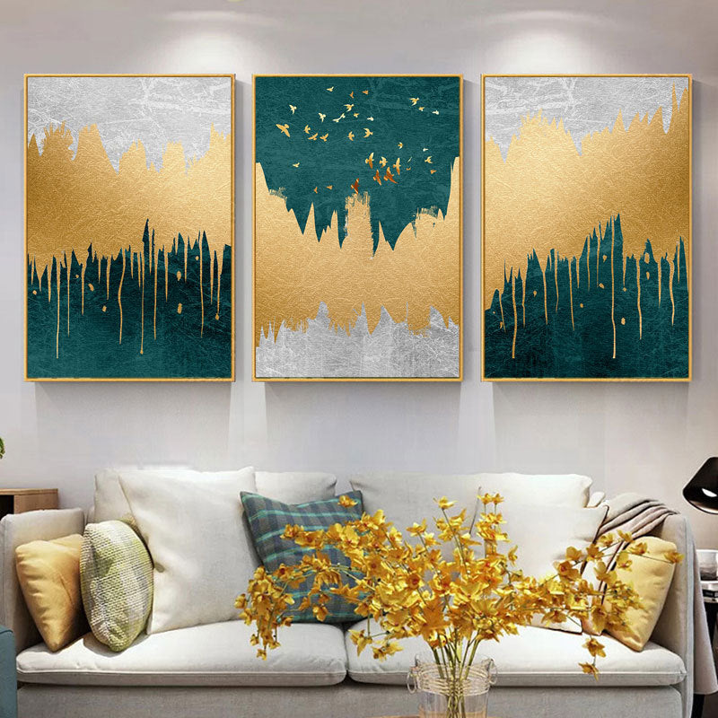 Gold, green, and gray canvas wall art on living room wall