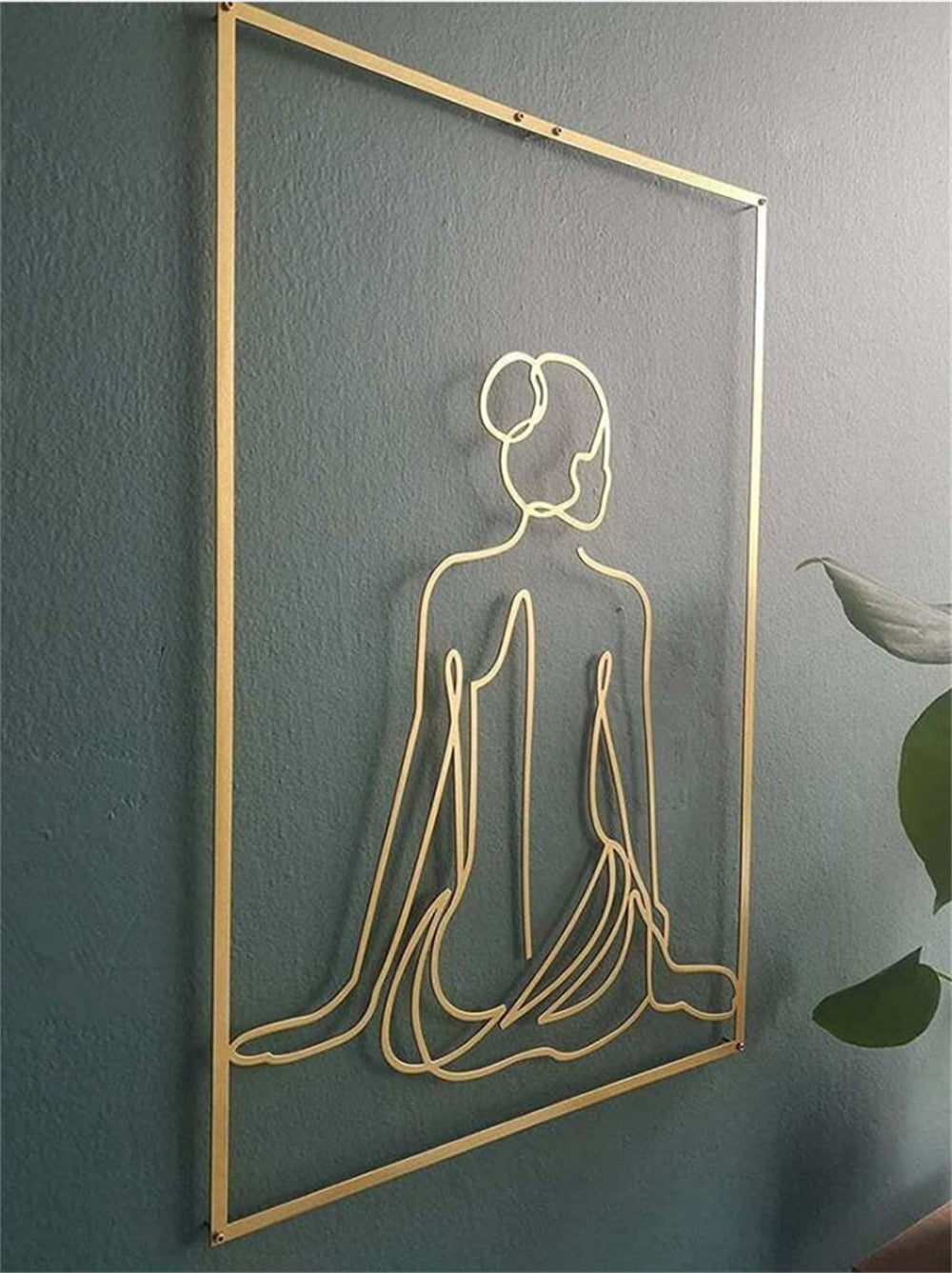 Golden wall decoration of a woman