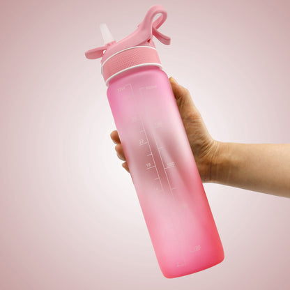 Pink gradient sports water bottle with water spray feature for hot days