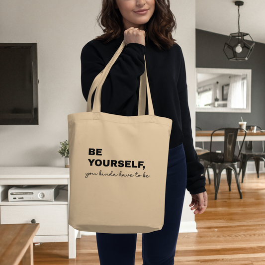 Woman holding designer tote bag