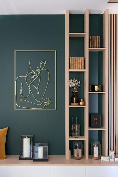 Gold framed wall art featuring female image